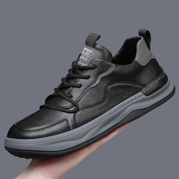 Brooks & Beck Marlow Leather Sneakers in Black - Side Profile in Hand